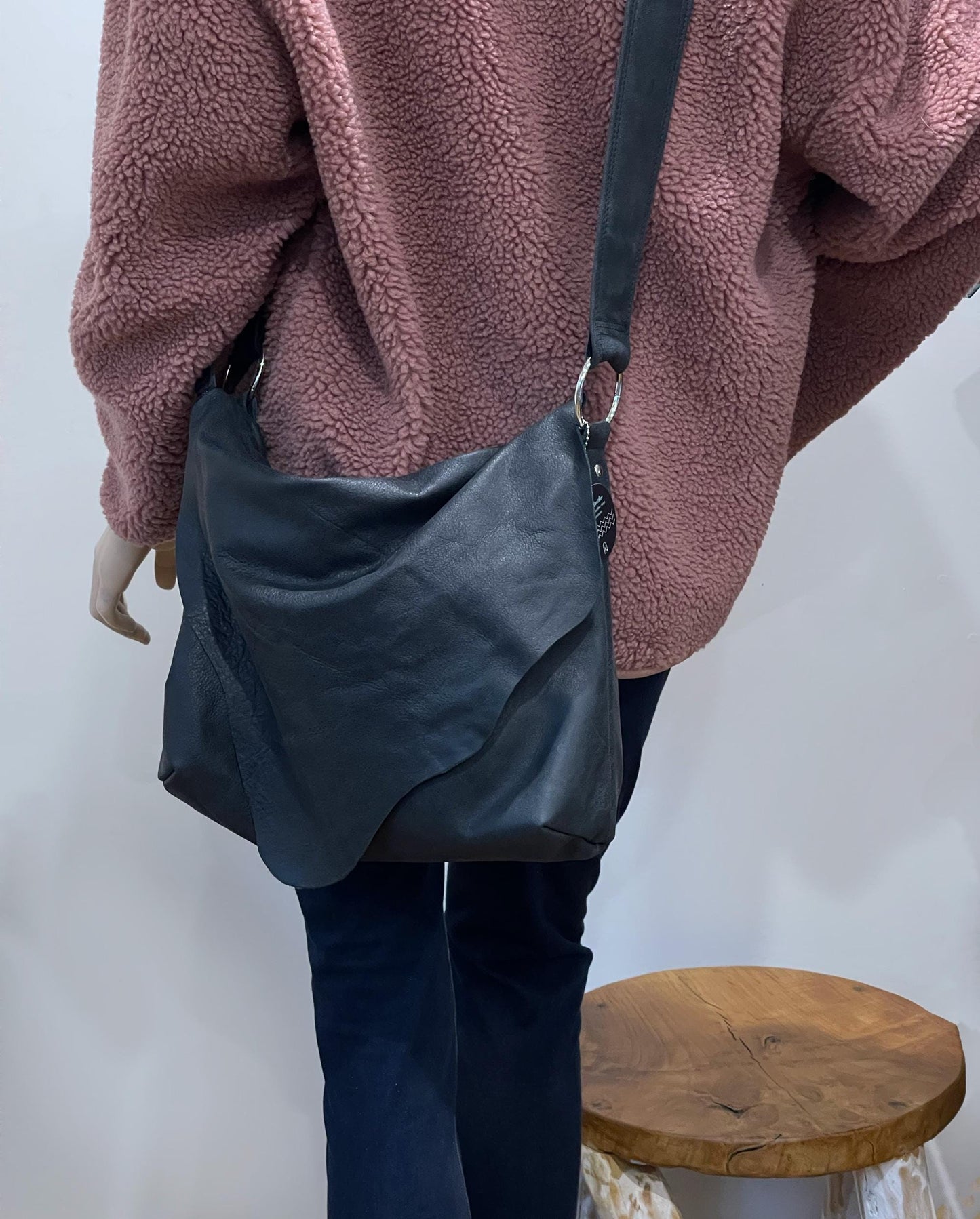 Distressed Black Leather Crossbody Bag with asymmetrical flap