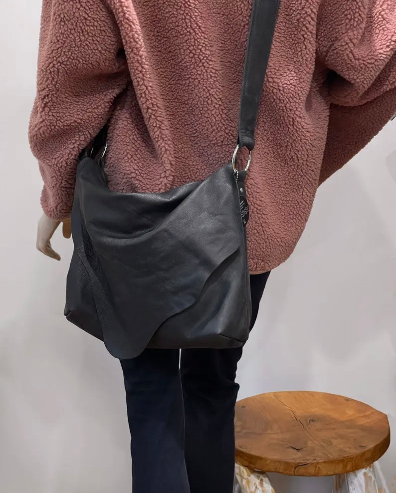 Distressed Black Leather Crossbody Bag with asymmetrical flap