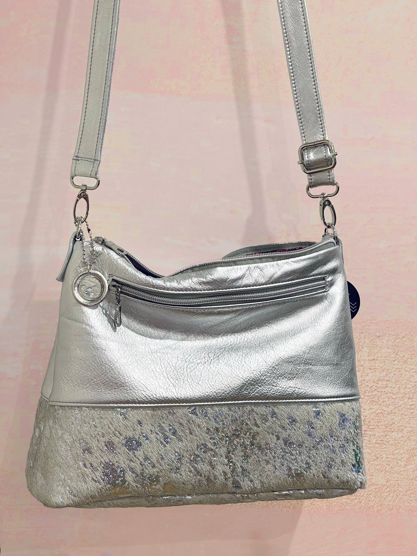 Holographic iridescent cowhide and metallic silver leather bag