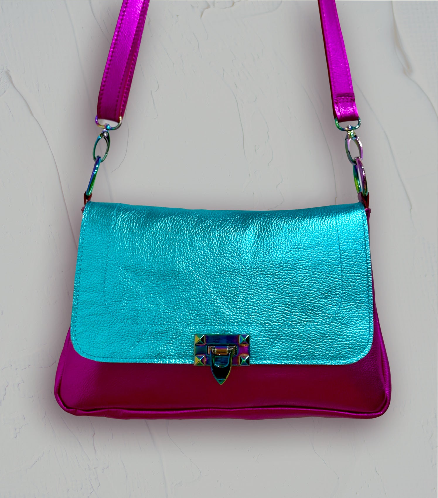 turquoise and pink flap close bag rainbow hardware