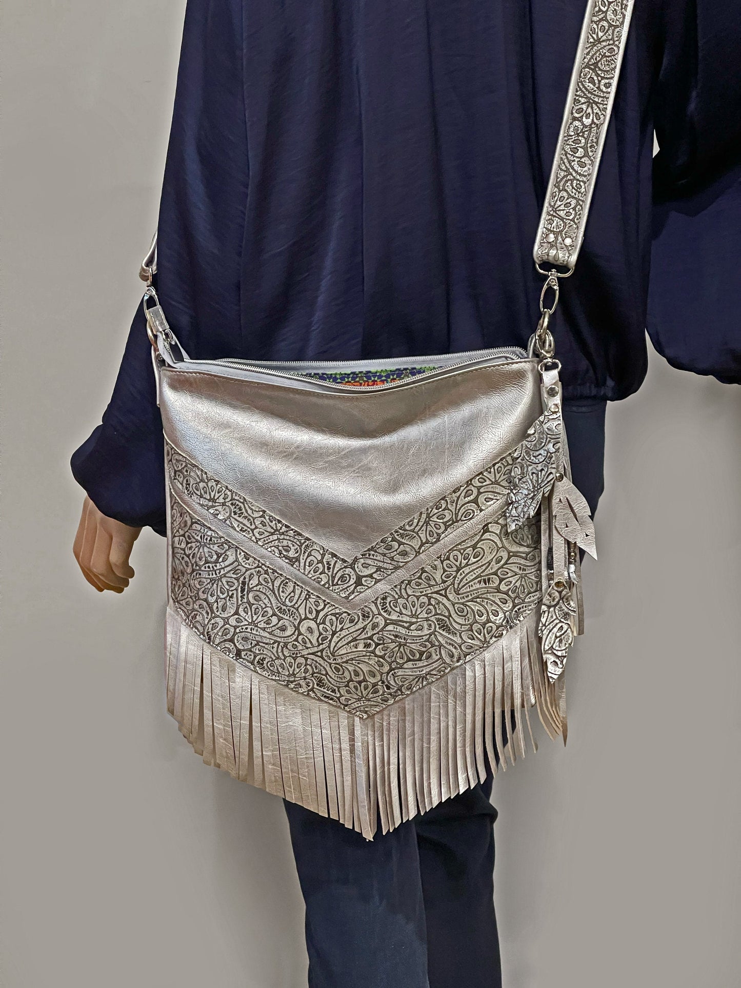 Metallic silver Leather Fringe Hobo Bag with featured tooled leather