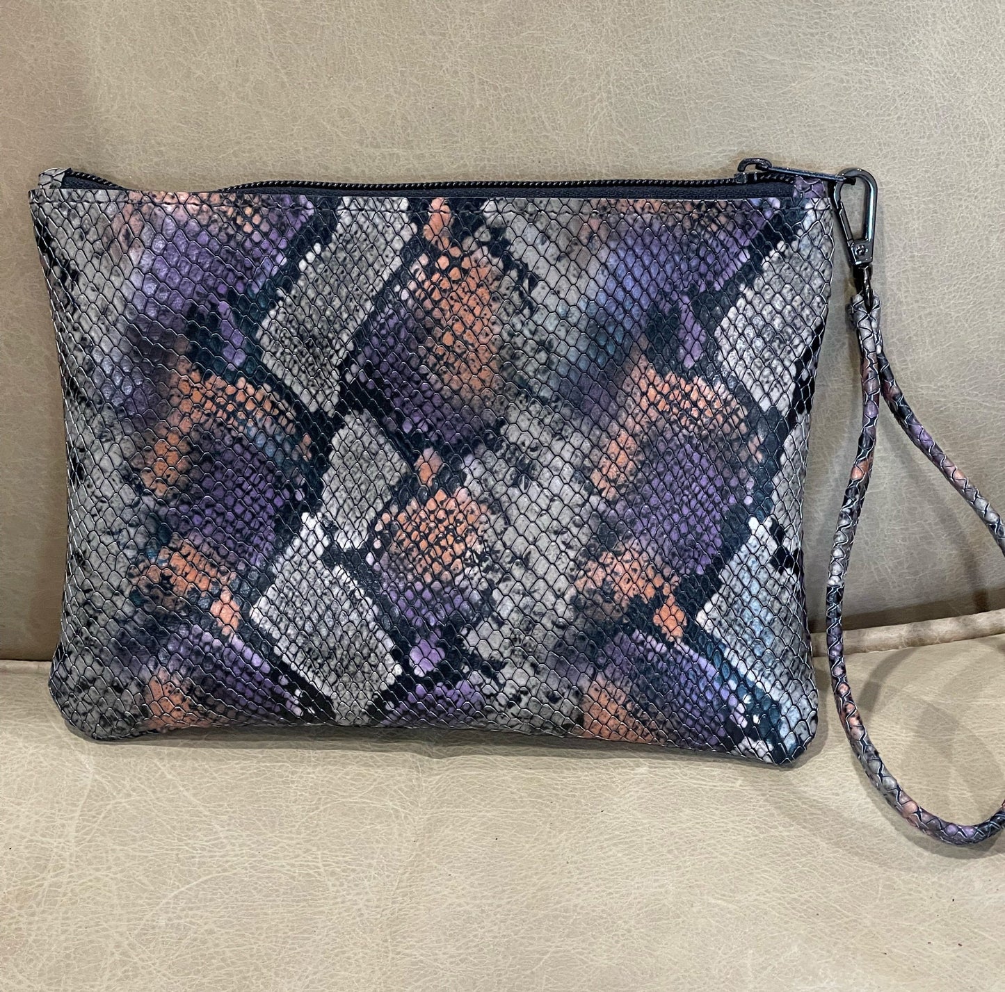Snake embossed clutch leather wristlet