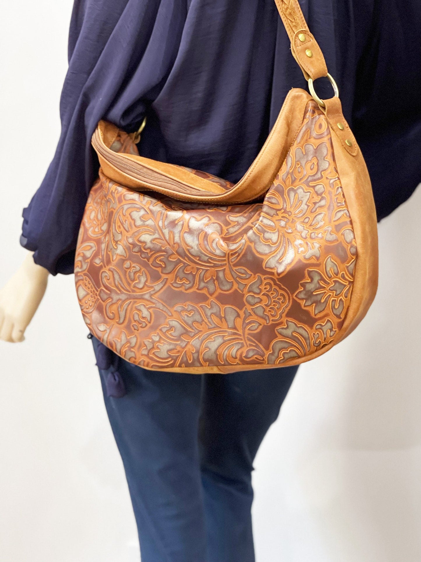 Large brown tooled embossed leather hobo bag