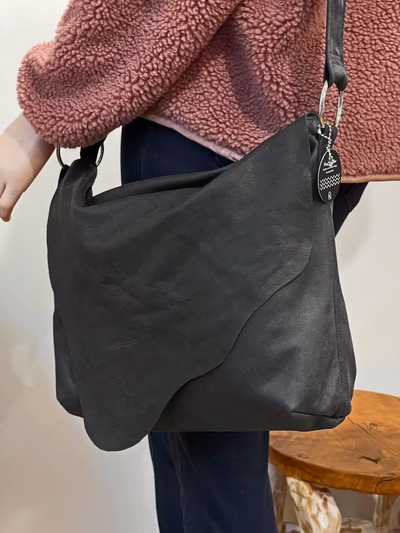 Distressed Black Leather Crossbody Bag with asymmetrical flap