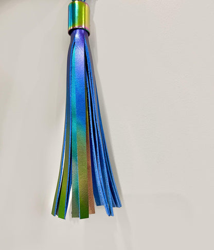 Multicolored tassel on a light gray background