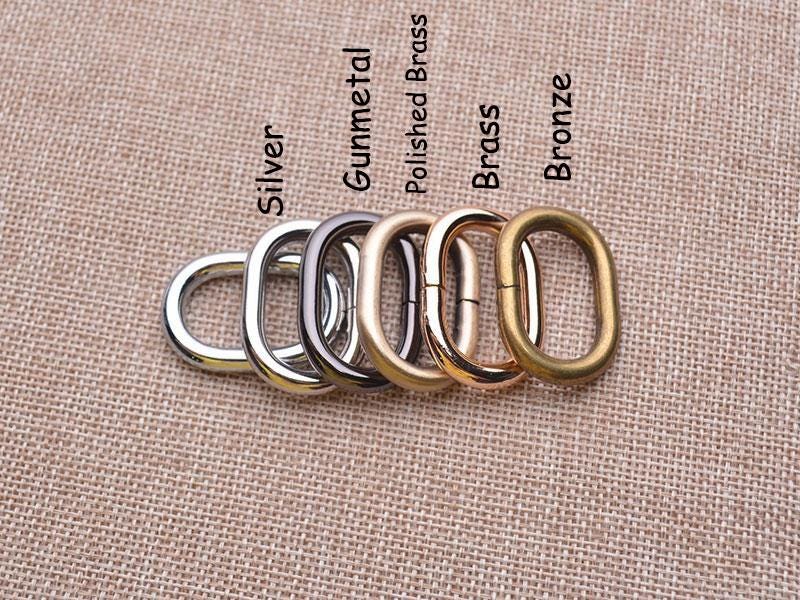 Set of hardware colour options in various finishes on a textured fabric background