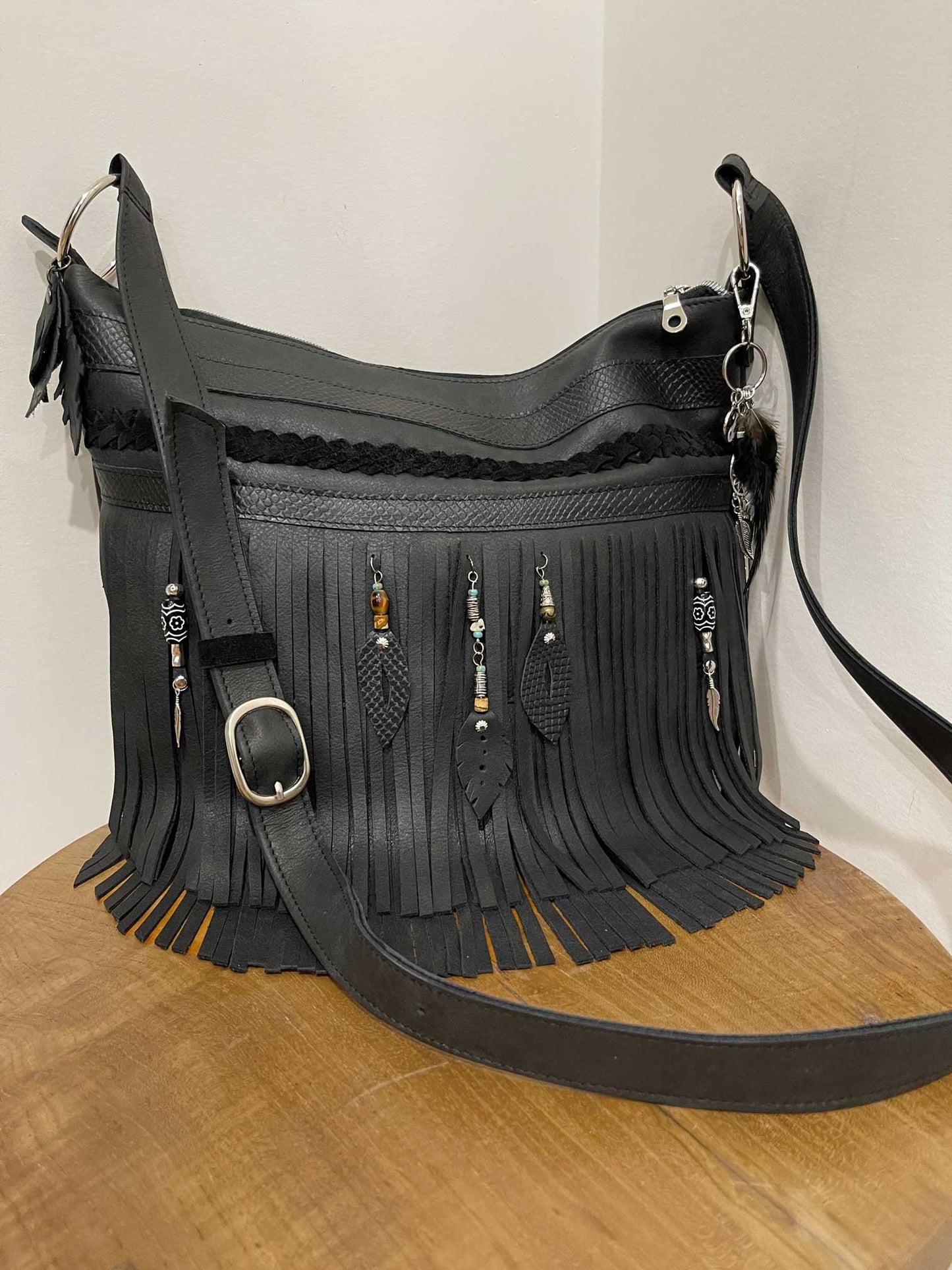 Black leather fringe handbag with beaded leather metal charms and solid silver buckle