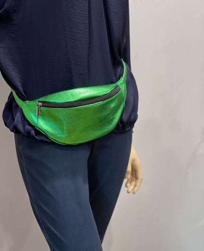 emerald Green metallic fanny pack worn by a person on a plain background