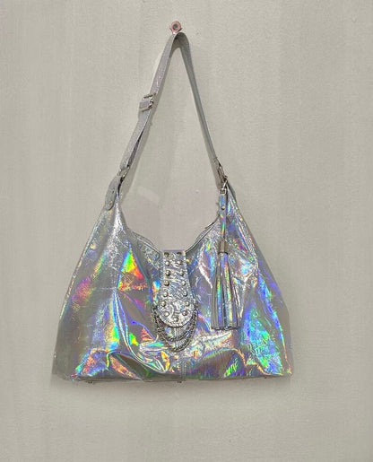 full view of entire Holographic handbag with a decorative riveted flap with chains and tassel