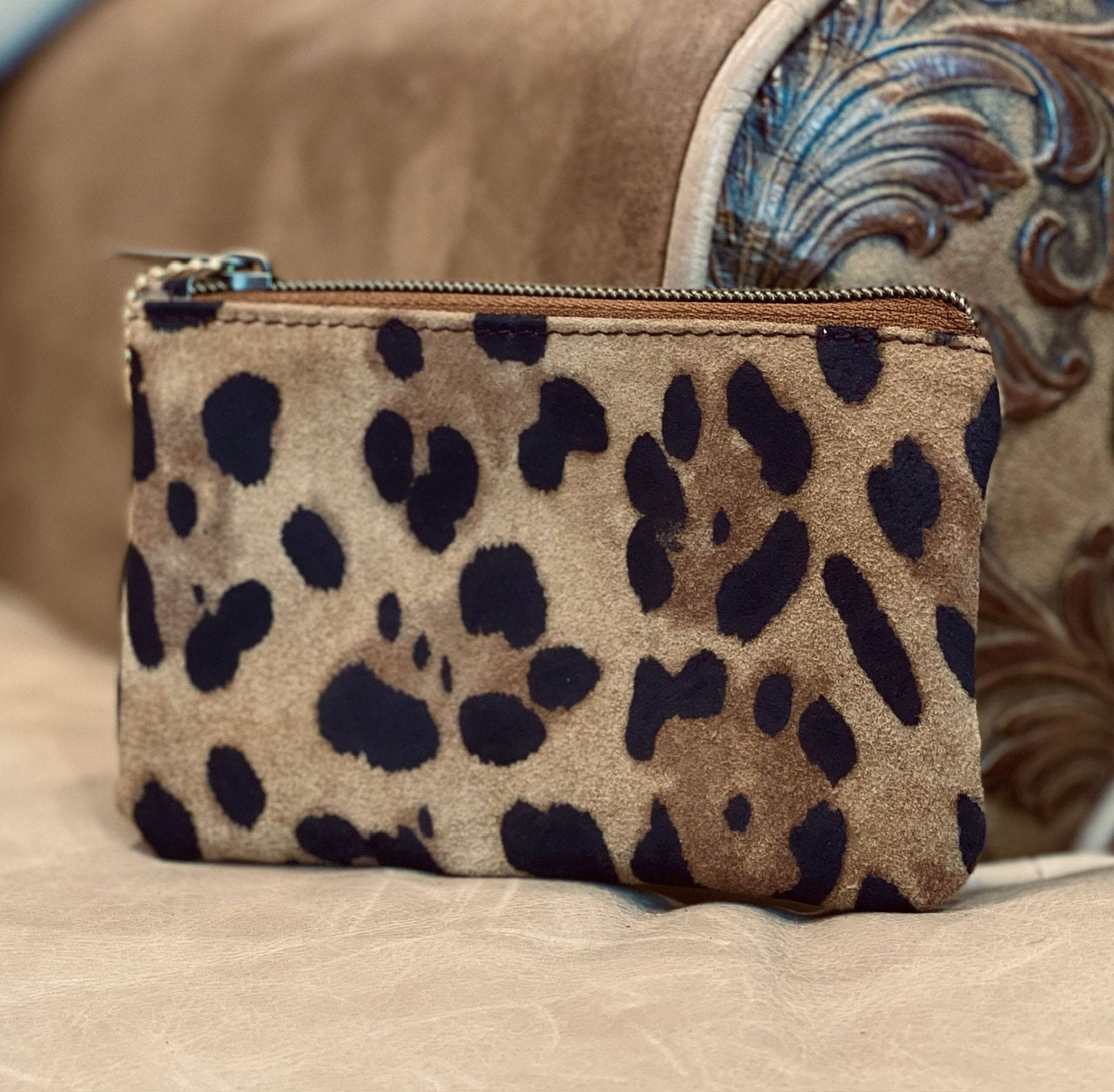 Leopard print pouch on a textured surface