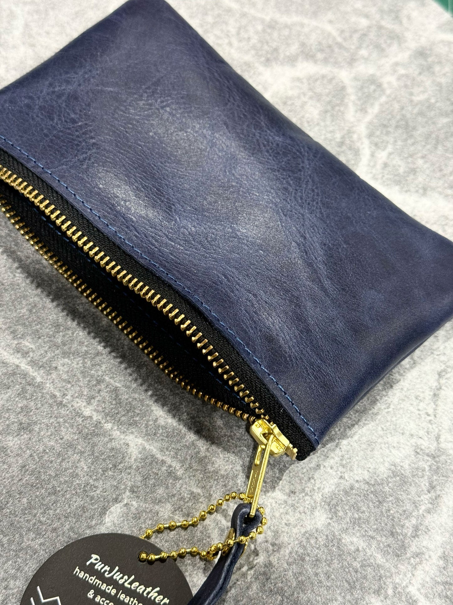 Blue leather pouch with brass zipper 