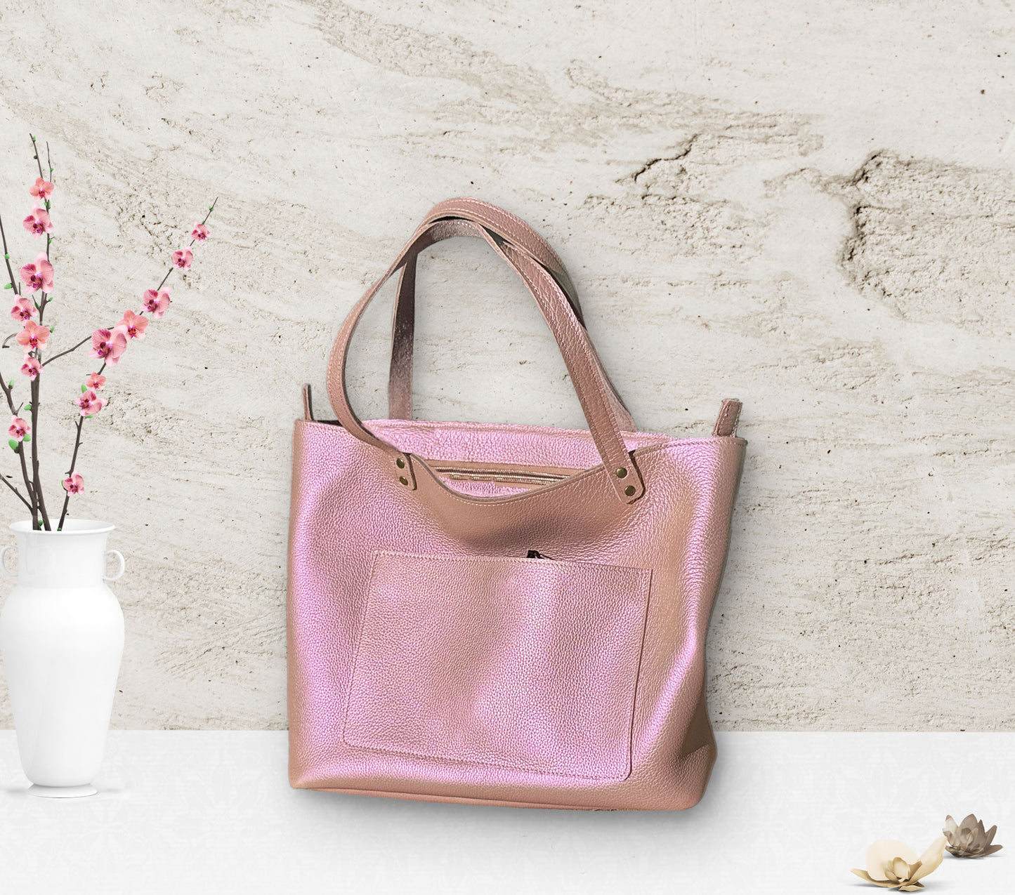 pearlised pink leather tote with zipper closure and outside slip pocket