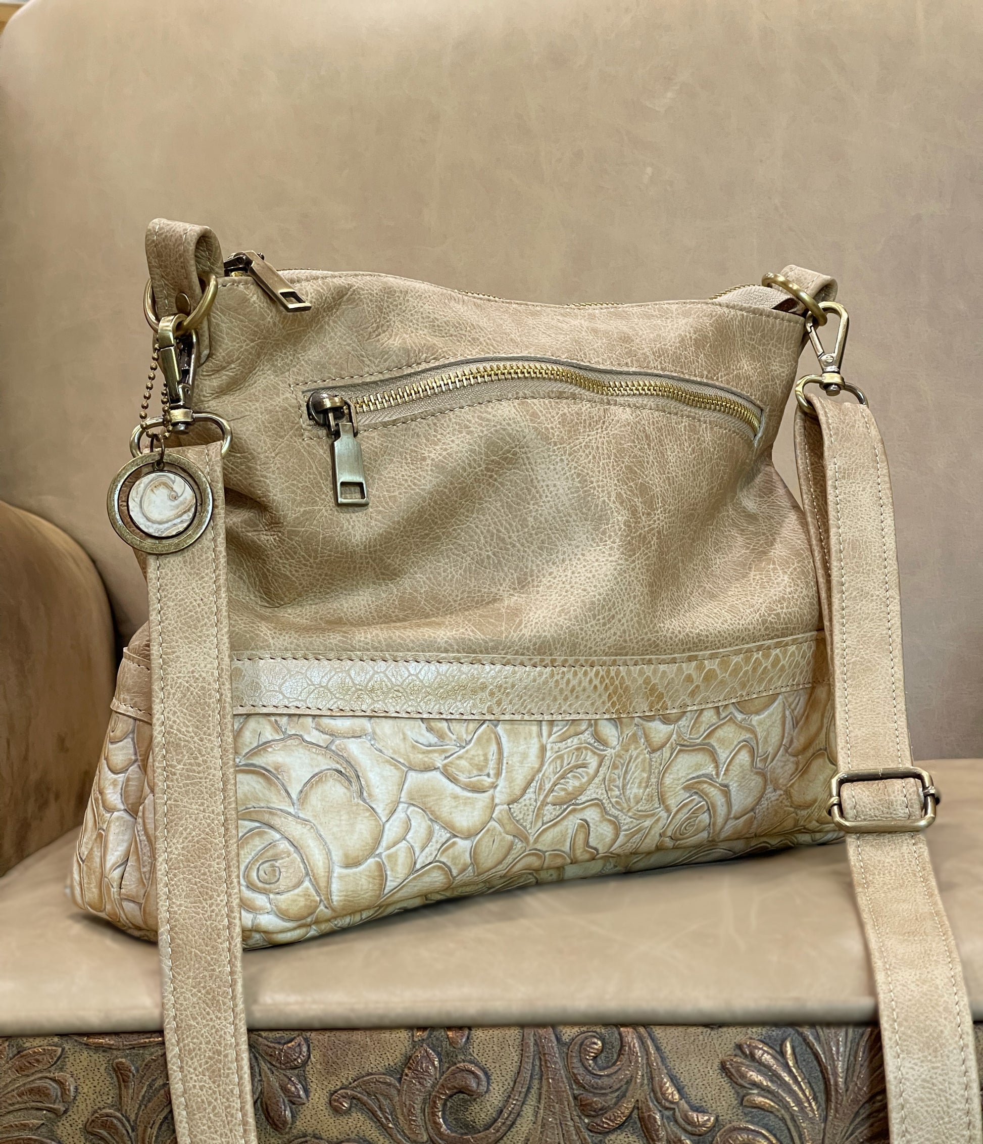 Tooled floral Ivory Cream leather bag with adjustable strap and outside zipper pocket and vintage tan leather